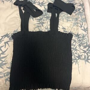 M fits like an xs black tank top with ties!